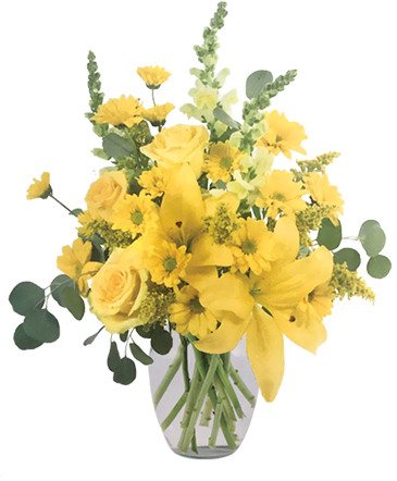 A yellow vase arrangement of lilies, roses and snapdragons